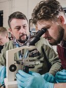 Man using microscope